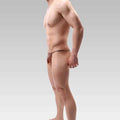 Malemodelwearinggoldthongsidepose