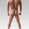Malemodelwearinggreenthongangledsidepose